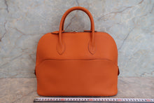 Load image into Gallery viewer, HERMES/BOLIDE 1923 Togo leather Orange Hand bag 700090061