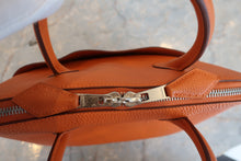 Load image into Gallery viewer, HERMES/BOLIDE 1923 Togo leather Orange Hand bag 700090061