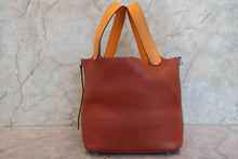 Load image into Gallery viewer, HERMES PICOTIN LOCK TOUCH MM Clemence leather/Swift leather Cuivre/Jaune d'or X Engraving Hand bag 700090134