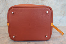 Load image into Gallery viewer, HERMES PICOTIN LOCK TOUCH MM Clemence leather/Swift leather Cuivre/Jaune d'or X Engraving Hand bag 700090134