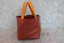 将图片加载到图库查看器,HERMES PICOTIN LOCK TOUCH MM Clemence leather/Swift leather Cuivre/Jaune d'or X刻印 Hand bag 800020266