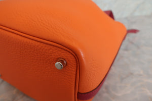 HERMES PICOTIN LOCK TOUCH PM Clemence leather/Swift leather Orange/Rouge Grenet X Engraving Hand bag 600090108