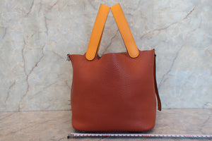HERMES PICOTIN LOCK TOUCH MM Clemence leather/Swift leather Cuivre/Jaune d'or X Engraving Hand bag 700090134