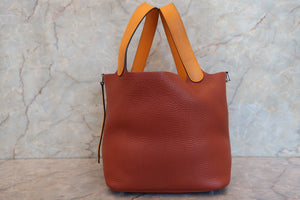 HERMES PICOTIN LOCK TOUCH MM Clemence leather/Swift leather Cuivre/Jaune d'or X Engraving Hand bag 700090134