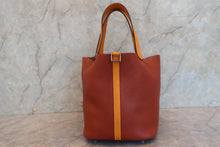 Load image into Gallery viewer, HERMES PICOTIN LOCK TOUCH MM Clemence leather/Swift leather Cuivre/Jaune d&#39;or X Engraving Hand bag 700090134
